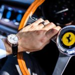 Wristwatch alongside Ferrari