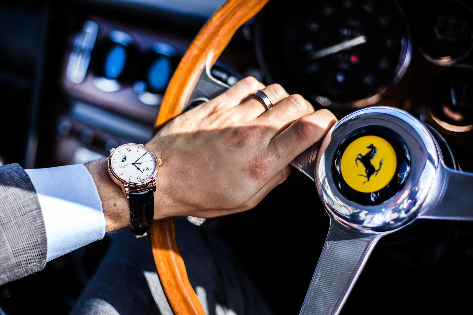 Wristwatch alongside Ferrari